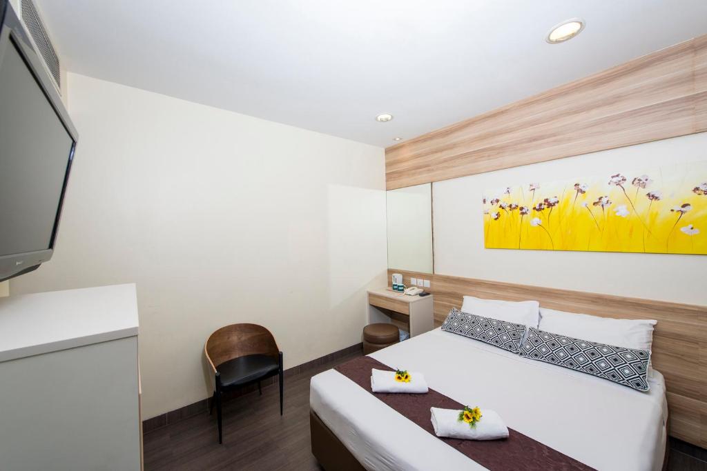 Postel nebo postele na pokoji v ubytování Hotel 81 Dickson