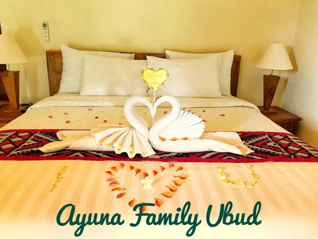 Postel nebo postele na pokoji v ubytování Ayuna Family Ubud