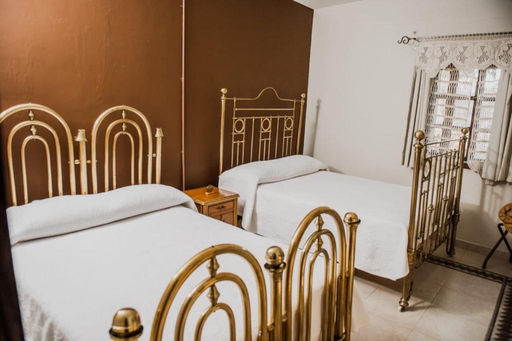 Postel nebo postele na pokoji v ubytování TIERRA SOÑADA HOTEL BOUTIQUE