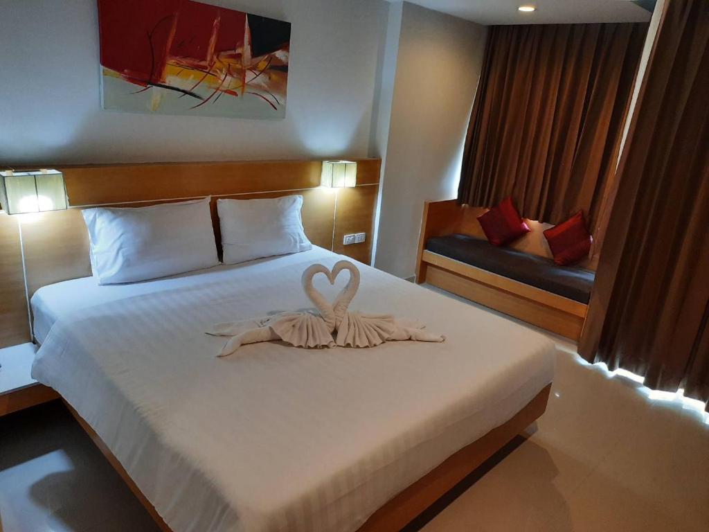 Postel nebo postele na pokoji v ubytování Aspery Hotel - SHA Certified