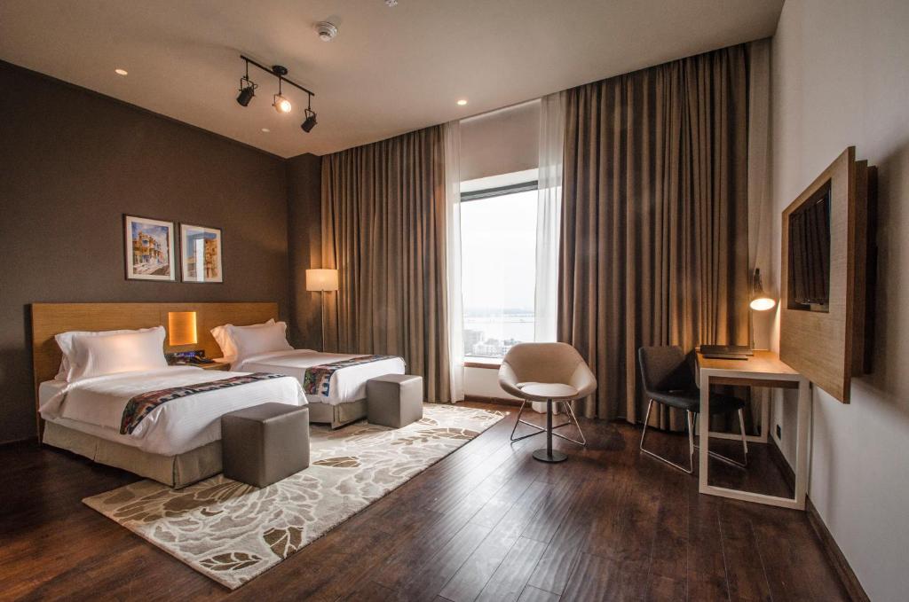 Postel nebo postele na pokoji v ubytování AltAir Boutique Hotel