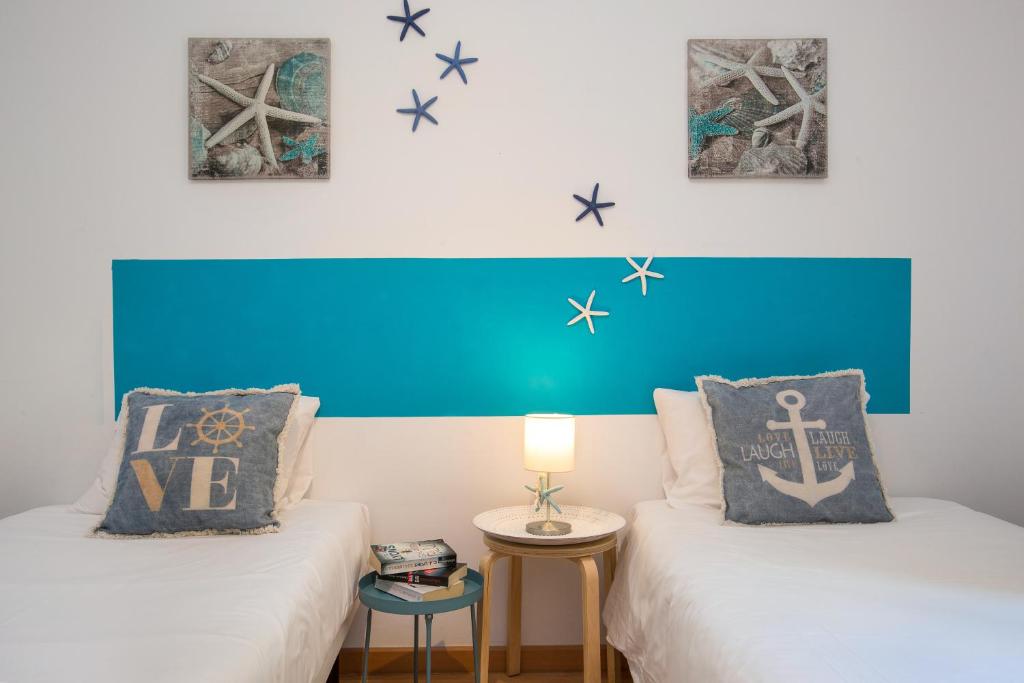 Postel nebo postele na pokoji v ubytování Stay U-nique Apartments Sicília