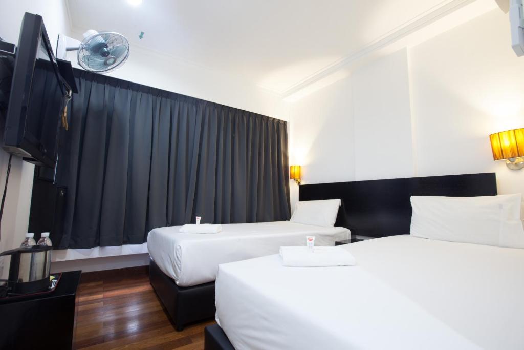 Postel nebo postele na pokoji v ubytování Tune Hotel - Waterfront Kuching
