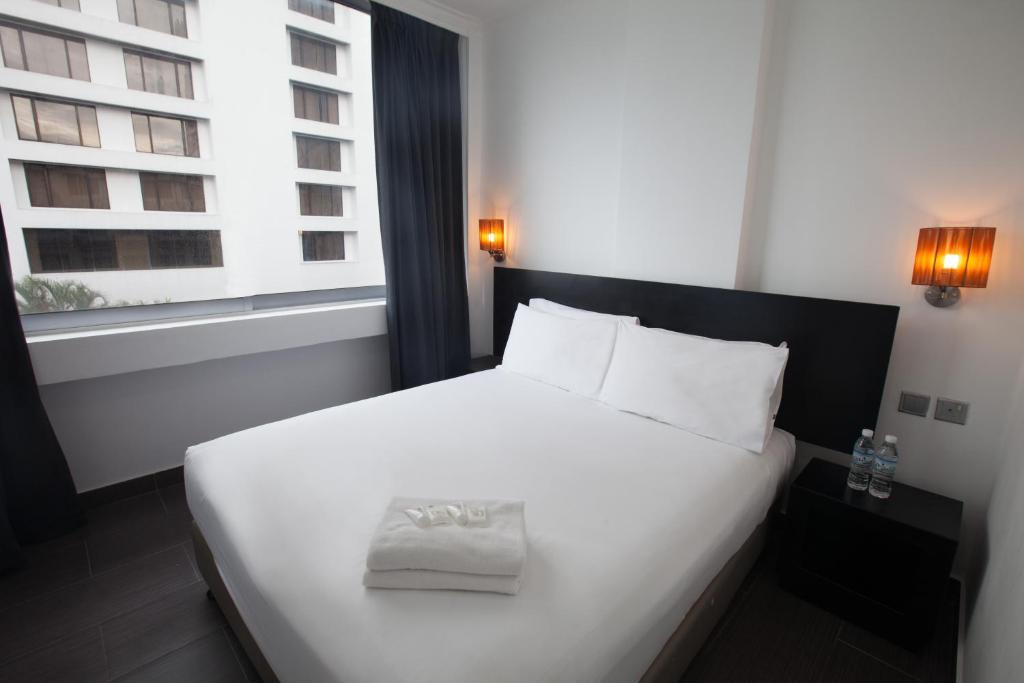 Postel nebo postele na pokoji v ubytování Tune Hotel - Waterfront Kuching