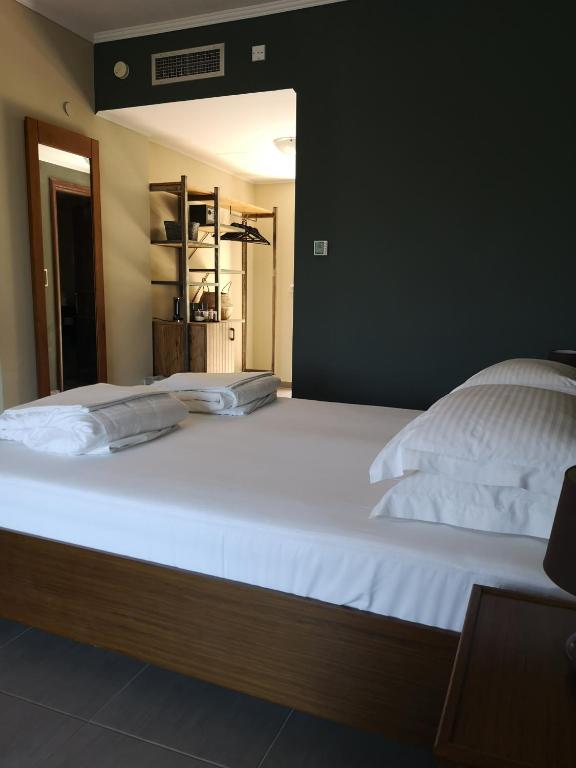 Postel nebo postele na pokoji v ubytování Ipsario Garden Hotel