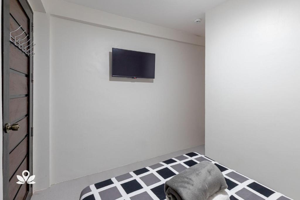 TV a/nebo společenská místnost v ubytování Happy Grey Hotel Vigan