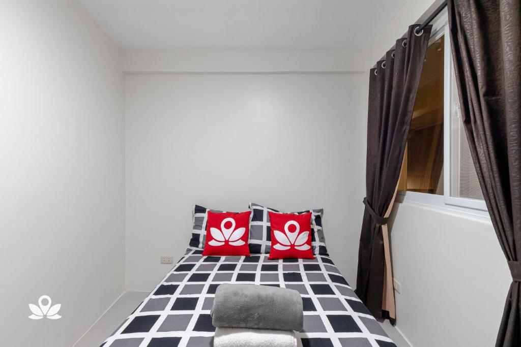 Postel nebo postele na pokoji v ubytování Happy Grey Hotel Vigan