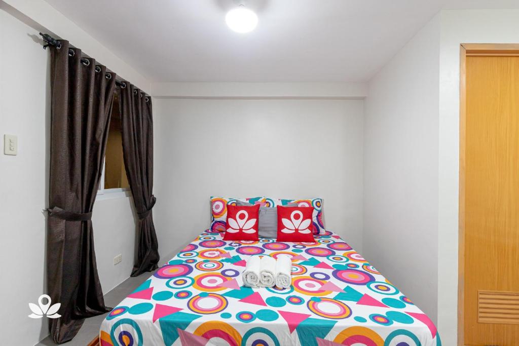 Postel nebo postele na pokoji v ubytování Happy Grey Hotel Vigan