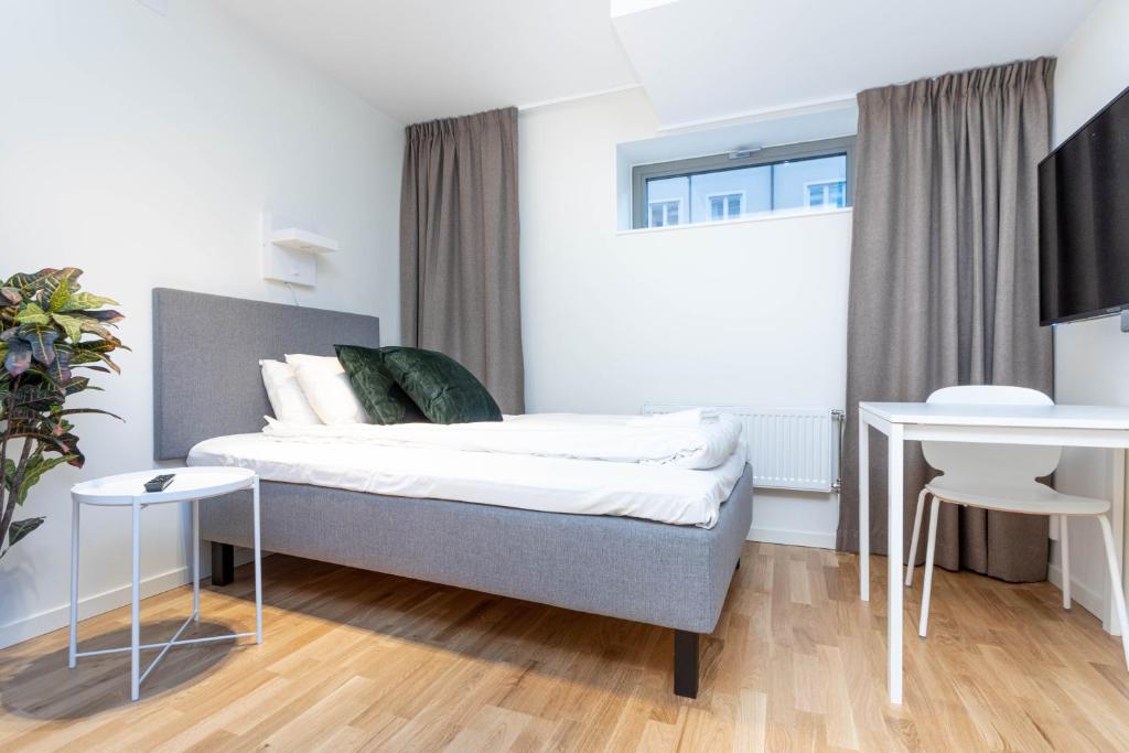Postel nebo postele na pokoji v ubytování ApartDirect Linköping Vasastaden