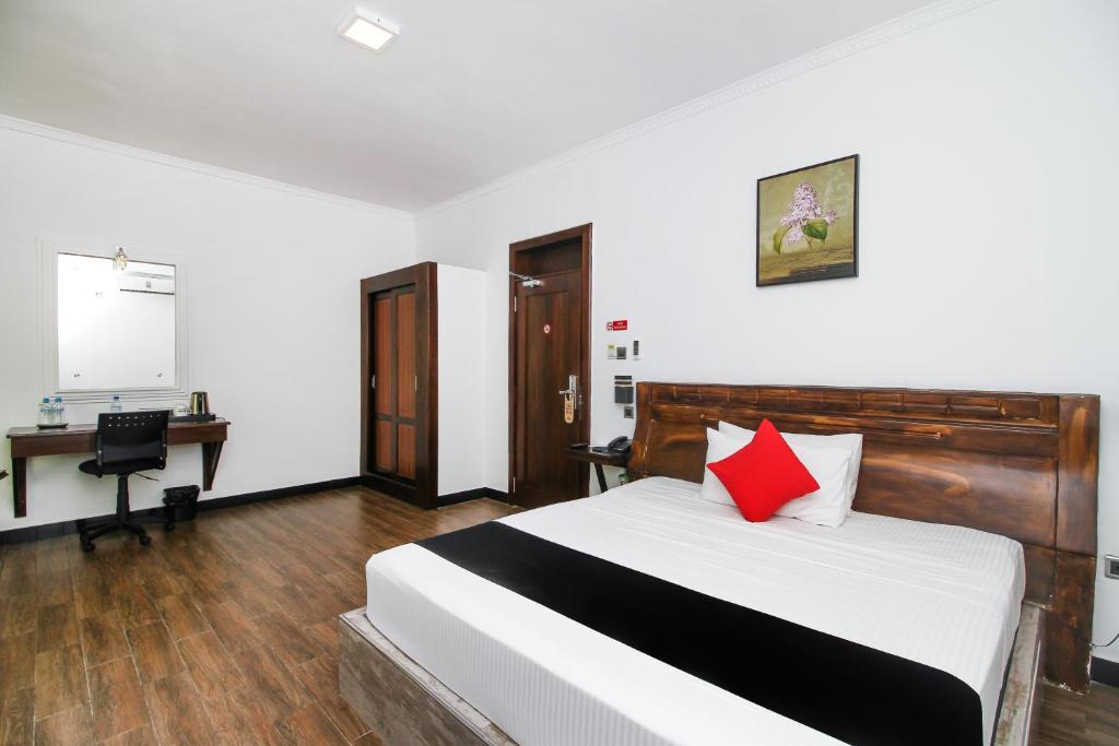 Postel nebo postele na pokoji v ubytování Sasha Transit Hotel
