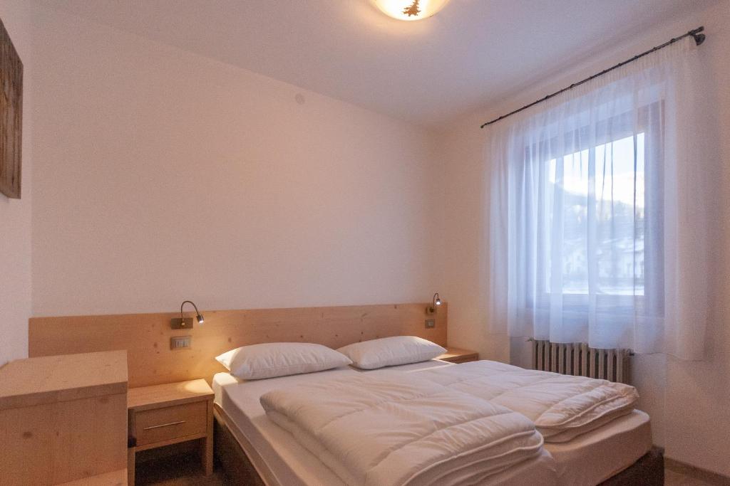 A bed or beds in a room at Casa Zulian