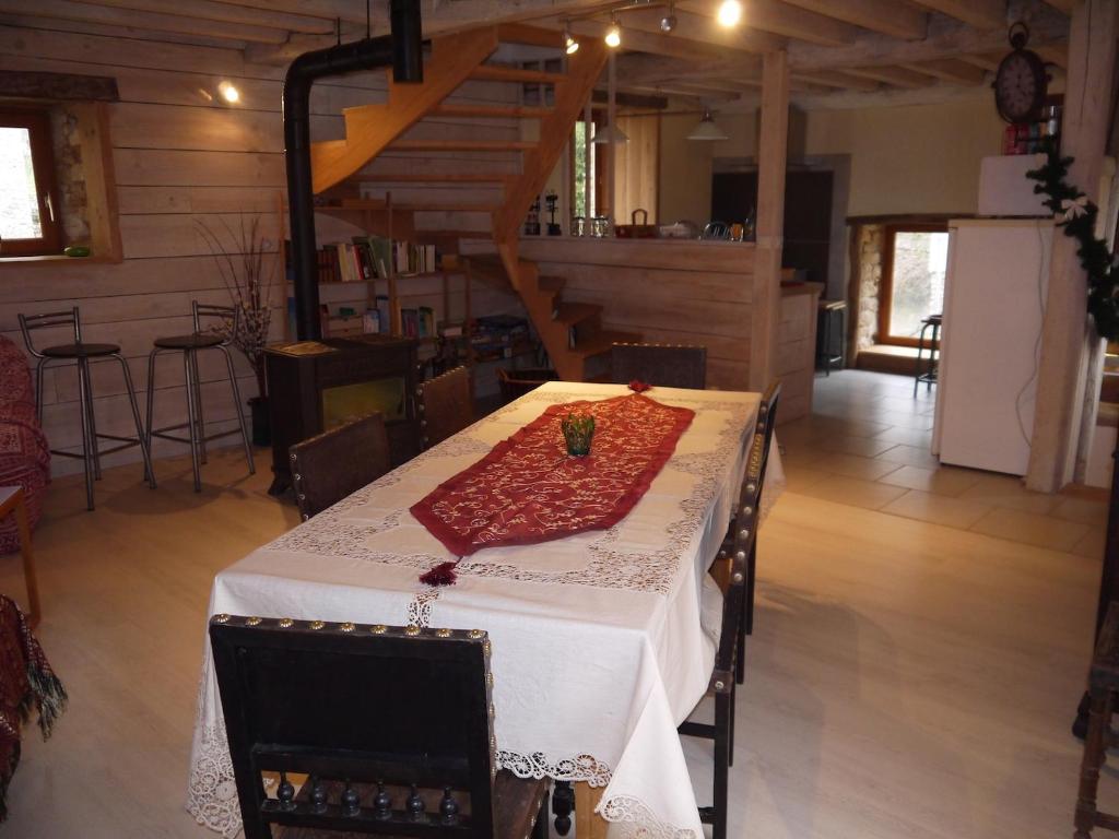 a table with a red napkin on top of it at La Grange in Saint-Père