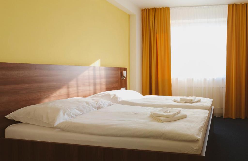 Postel nebo postele na pokoji v ubytování Hotel Zobor