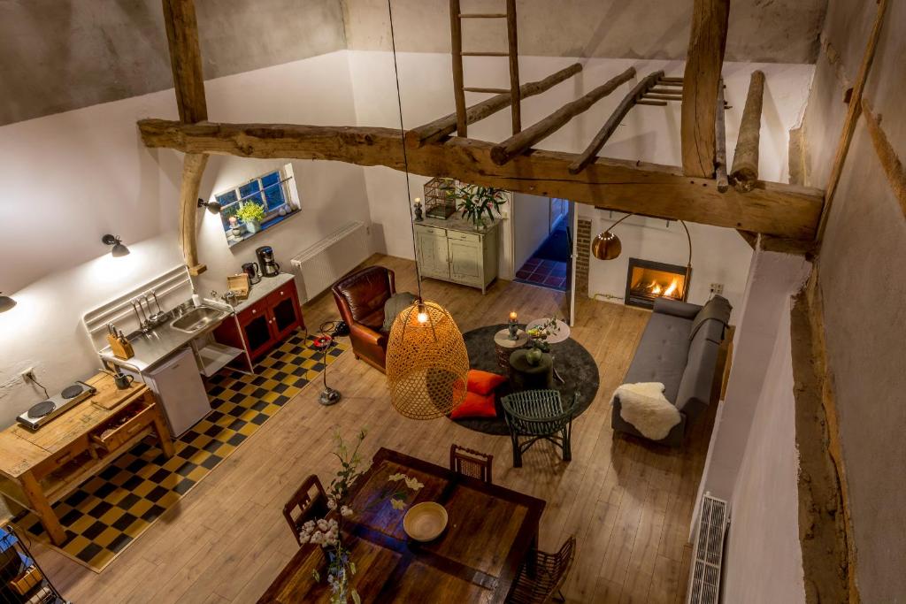 an overhead view of a kitchen and a living room at Aan de Holle Weg. Zeer landelijk gelegen verbouwde stal tot woning in Nuth