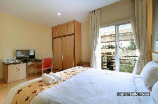 Postel nebo postele na pokoji v ubytování Mutiara Suites