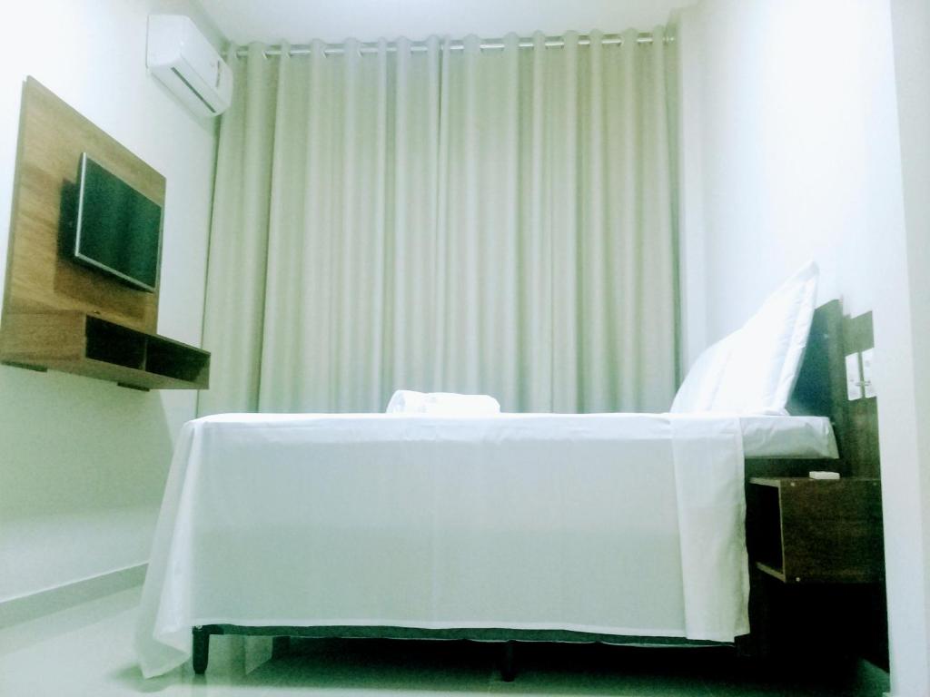 TV a/nebo společenská místnost v ubytování O Neves Hotel