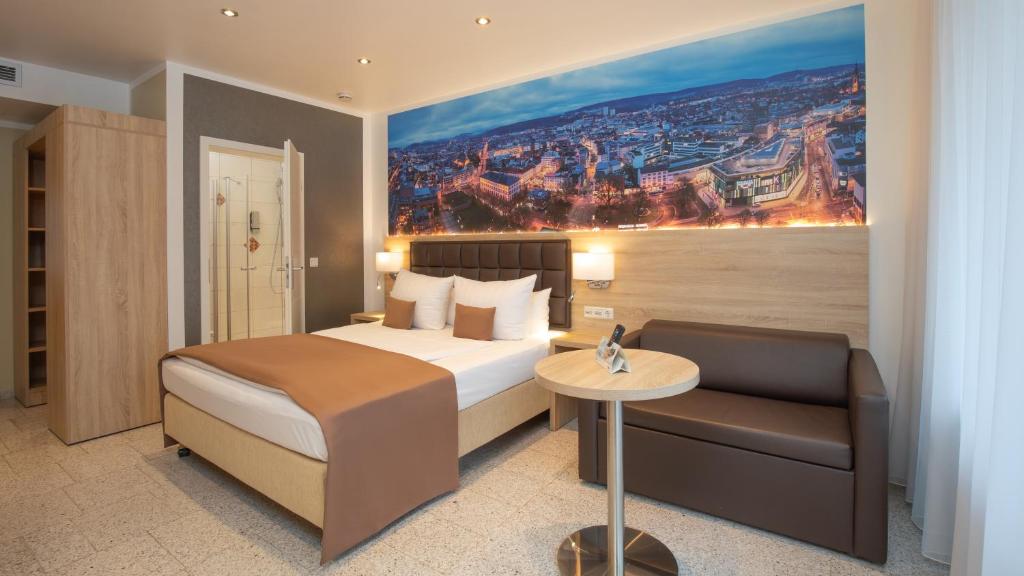 Krevet ili kreveti u jedinici u okviru objekta Hotel-Restaurant Barbarossahof