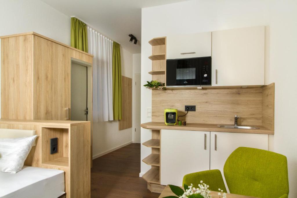 Kuchyň nebo kuchyňský kout v ubytování Living Hallertau
