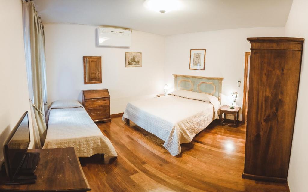 A bed or beds in a room at Agriturismo Le Anfore