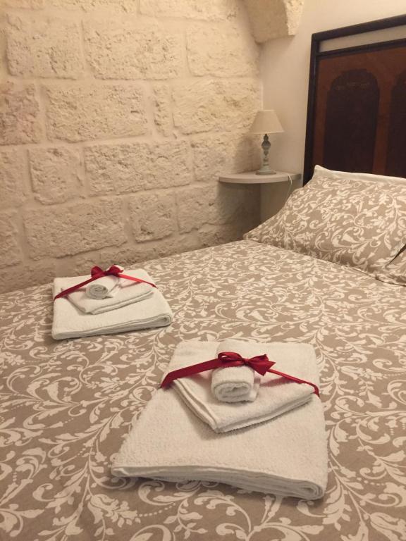 Postel nebo postele na pokoji v ubytování Al Caveau - Holiday House