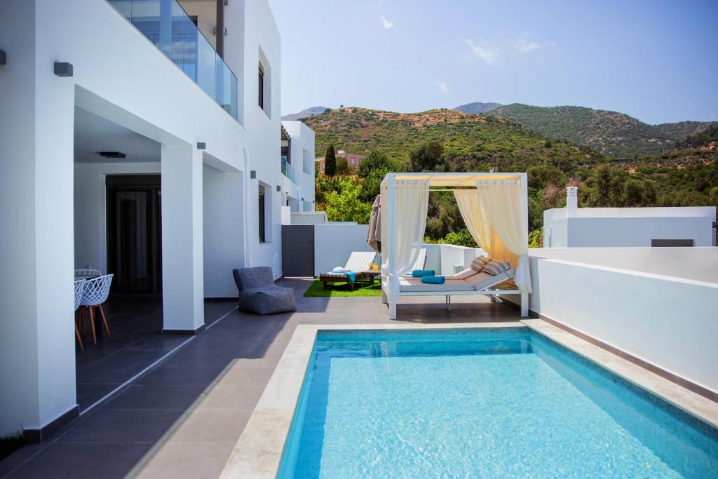 a villa with a swimming pool on a building at Adrianna Villa 2 in Balíon