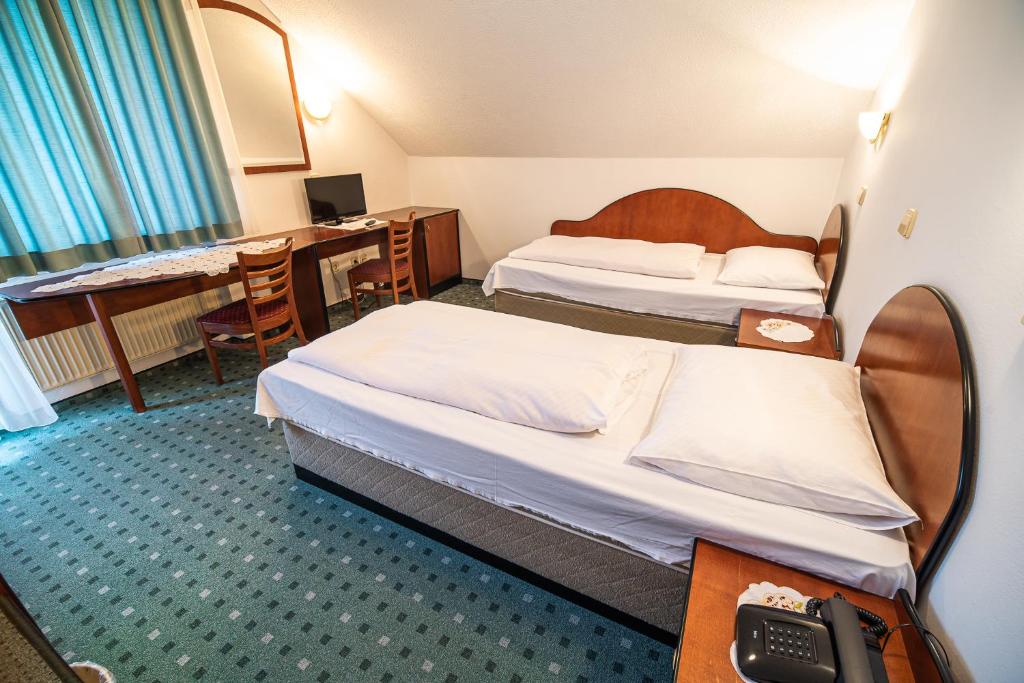 Postel nebo postele na pokoji v ubytování Guesthouse Leski Dvor