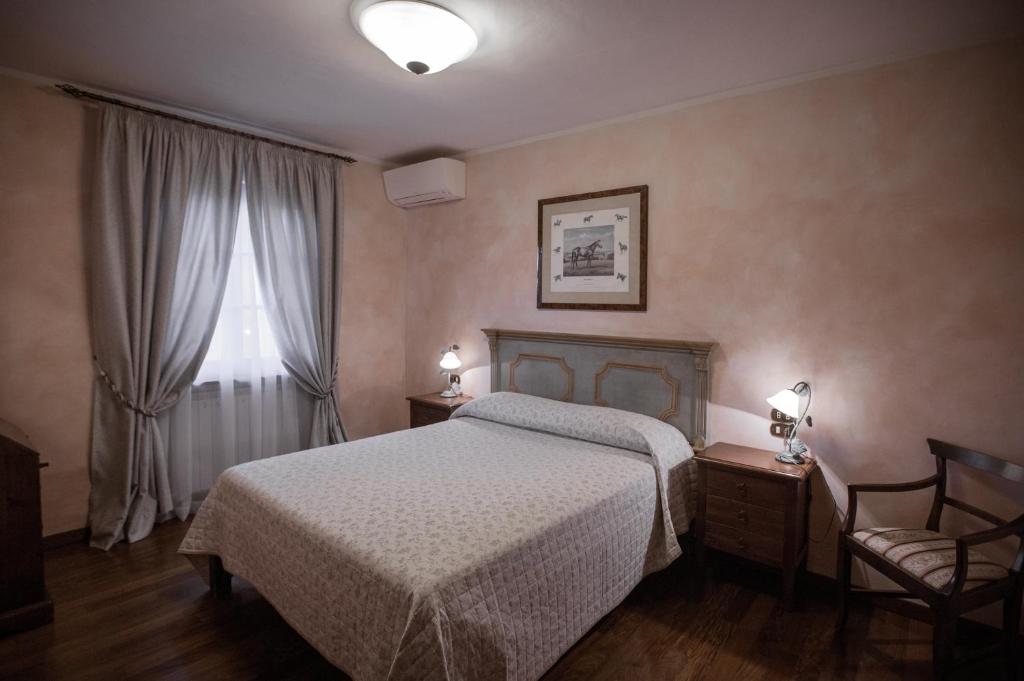 A bed or beds in a room at Agriturismo Le Anfore