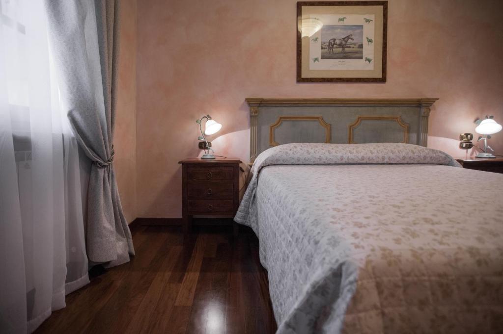 A bed or beds in a room at Agriturismo Le Anfore