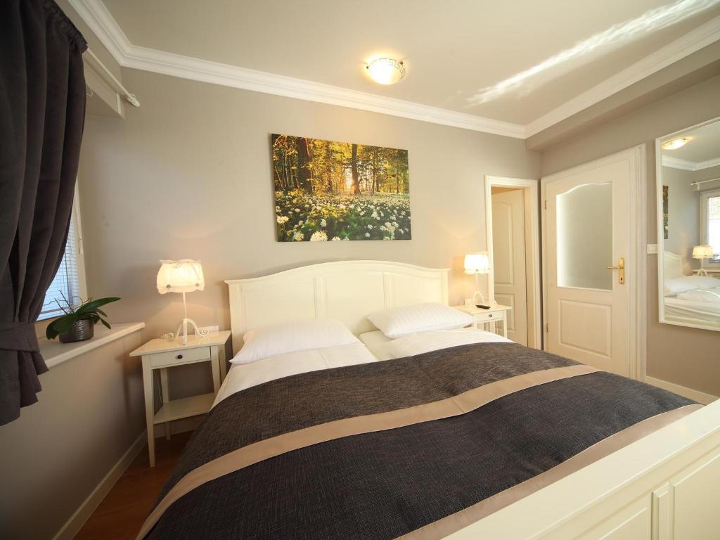 Postel nebo postele na pokoji v ubytování Vila Edelweiss Rooms&App Kranjska Gora