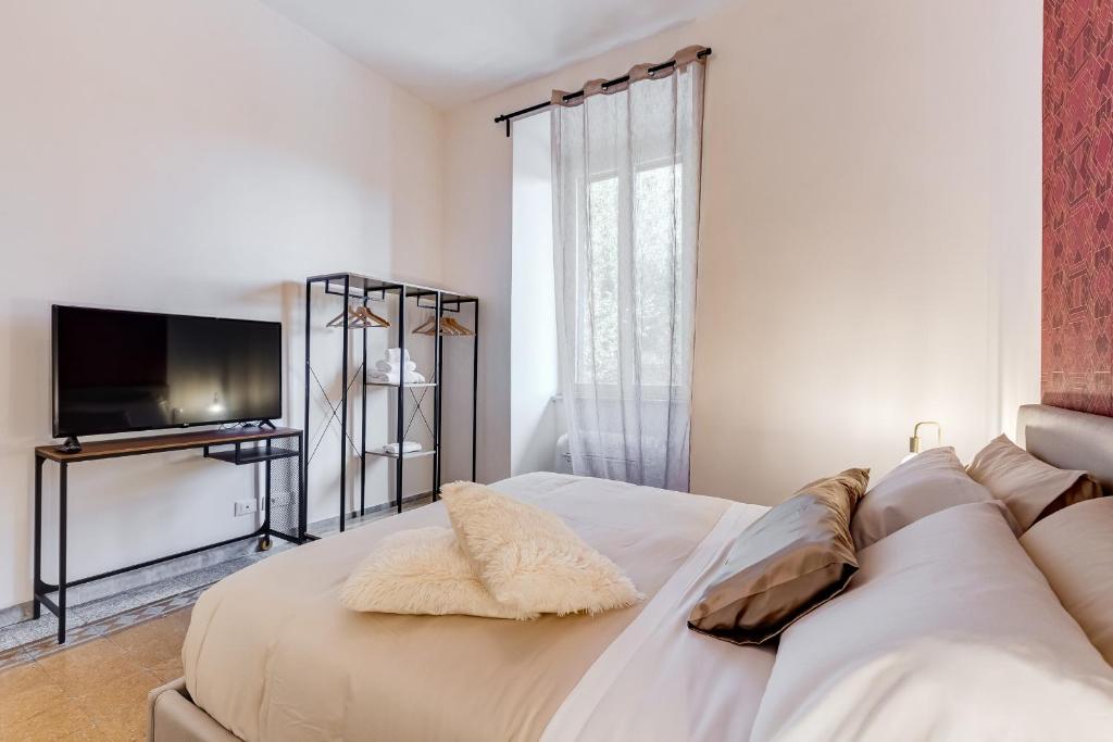 Łóżko lub łóżka w pokoju w obiekcie BDC - Termini Sun Apartment