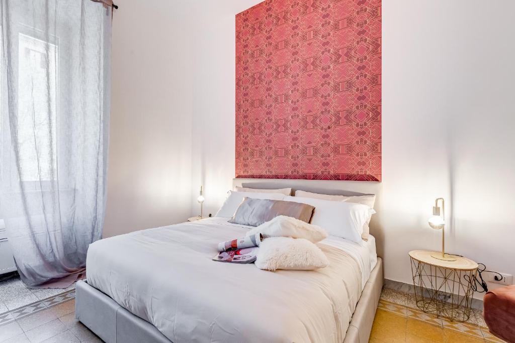 Łóżko lub łóżka w pokoju w obiekcie BDC - Termini Sun Apartment