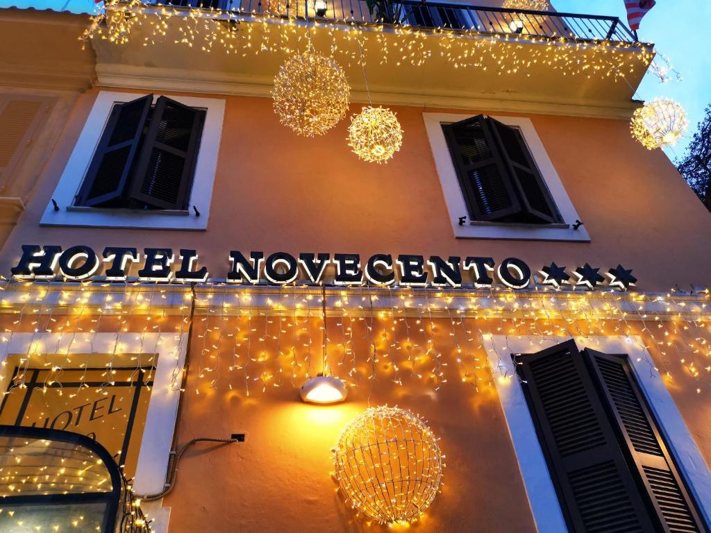 a hotel move centre sign on a building with christmas lights at Hotel Novecento in Rome