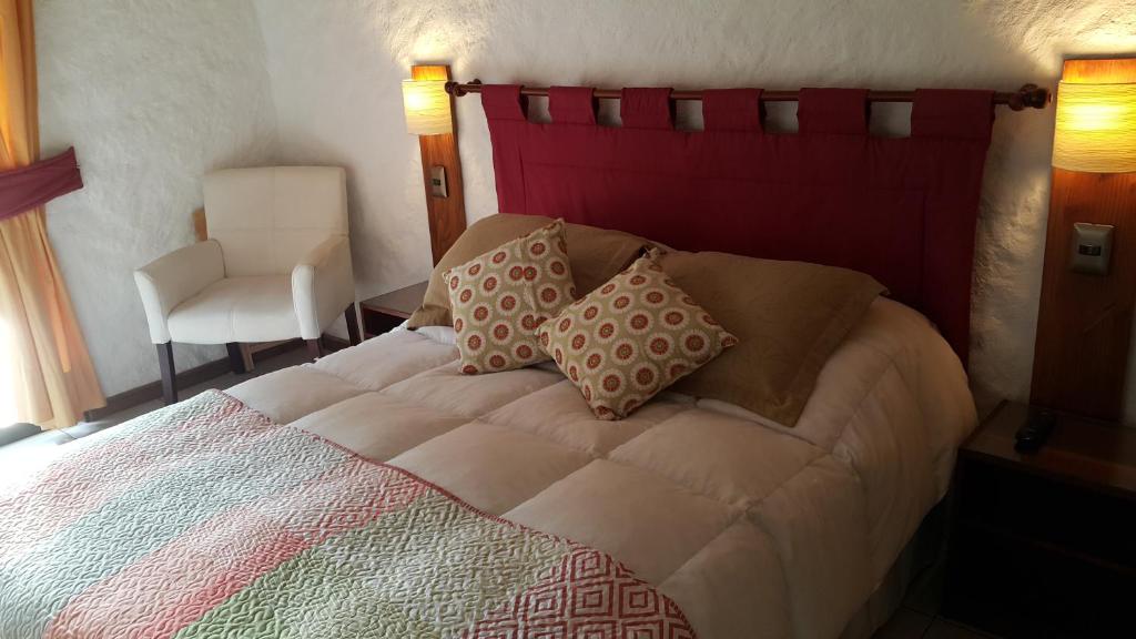 Postel nebo postele na pokoji v ubytování Stellamar Apart Hotel