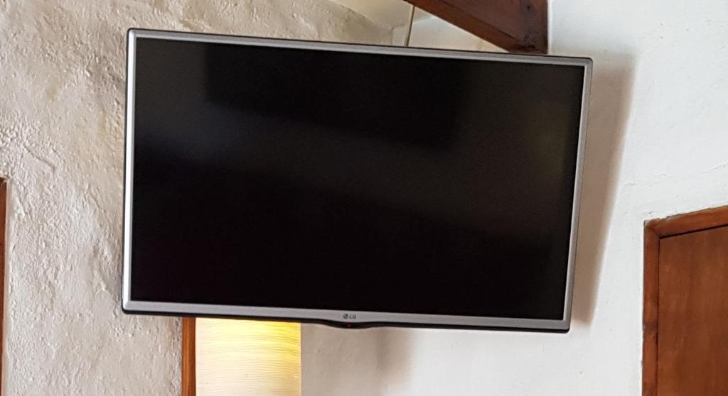 TV a/nebo společenská místnost v ubytování Stellamar Apart Hotel