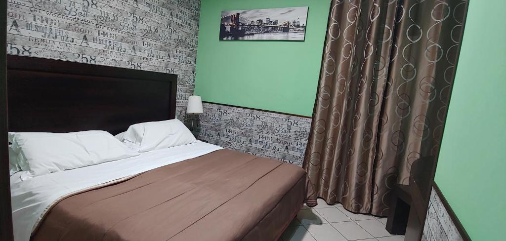 Postel nebo postele na pokoji v ubytování Sorrento Relais