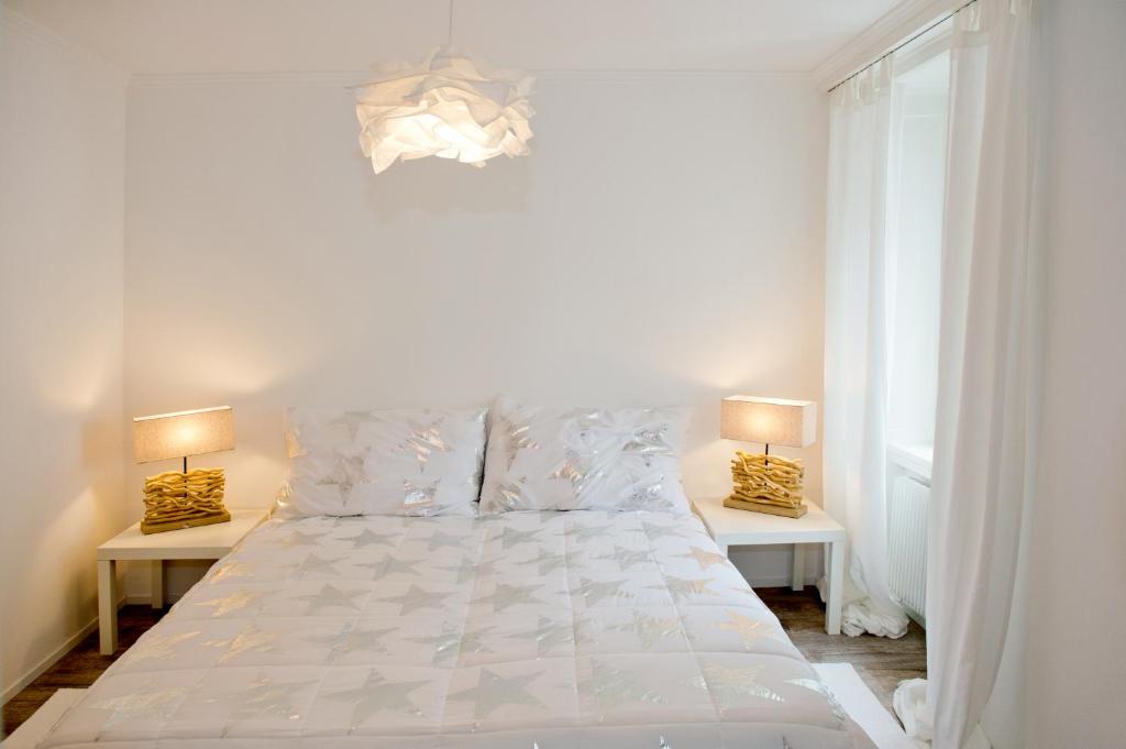 Postel nebo postele na pokoji v ubytování Hotel Bellevue
