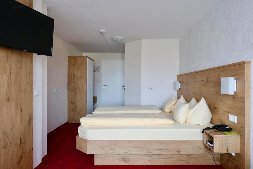 Postel nebo postele na pokoji v ubytování DEVA Hotel Renchtalblick
