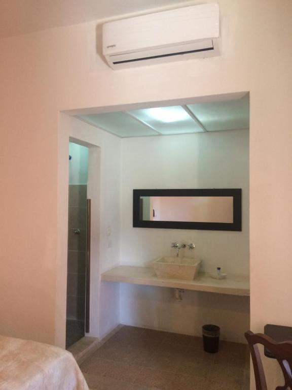 Postel nebo postele na pokoji v ubytování Hotel Mejorada Merida