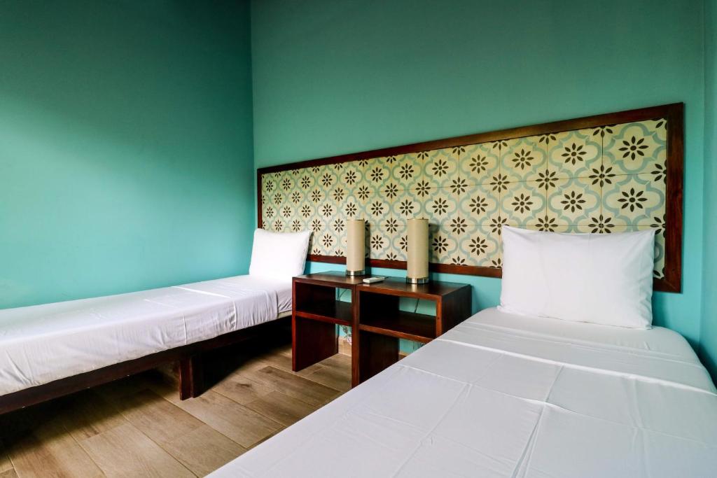 Postel nebo postele na pokoji v ubytování Teva Hotel & Jungle Reserve