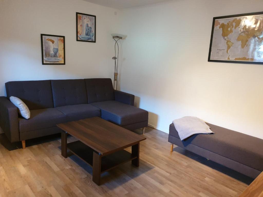 a living room with a couch and a coffee table at Familie Seibert in Bergen