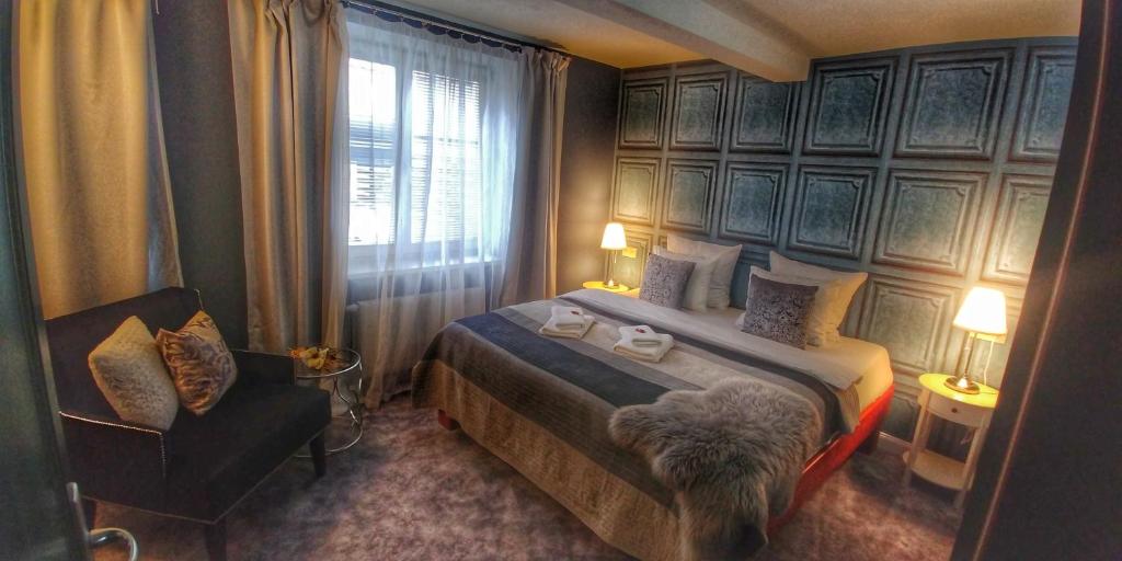 Postel nebo postele na pokoji v ubytování Hotel Telč