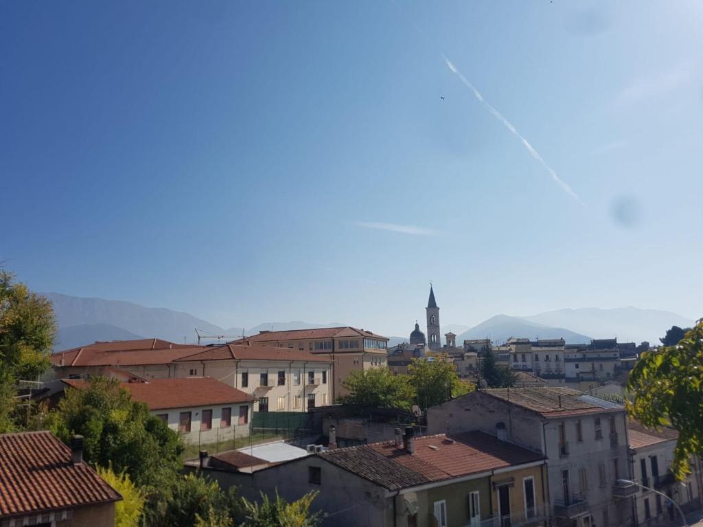 a view of a city with buildings and a church at GUFO VERDE in Sulmona