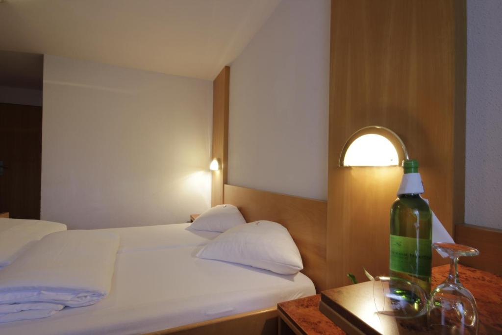Postel nebo postele na pokoji v ubytování Hotel Tia Monte