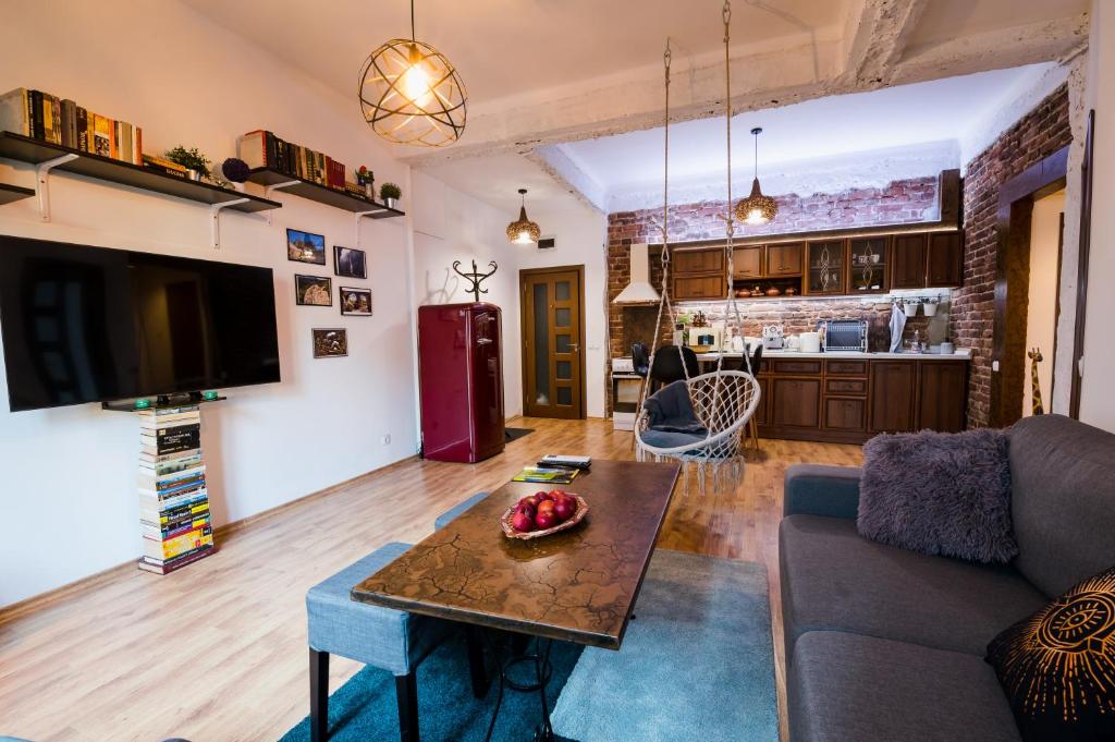 a living room with a couch and a table at Top Center Relax, NDK & Vitosha str, FREE Secured parking in Sofia