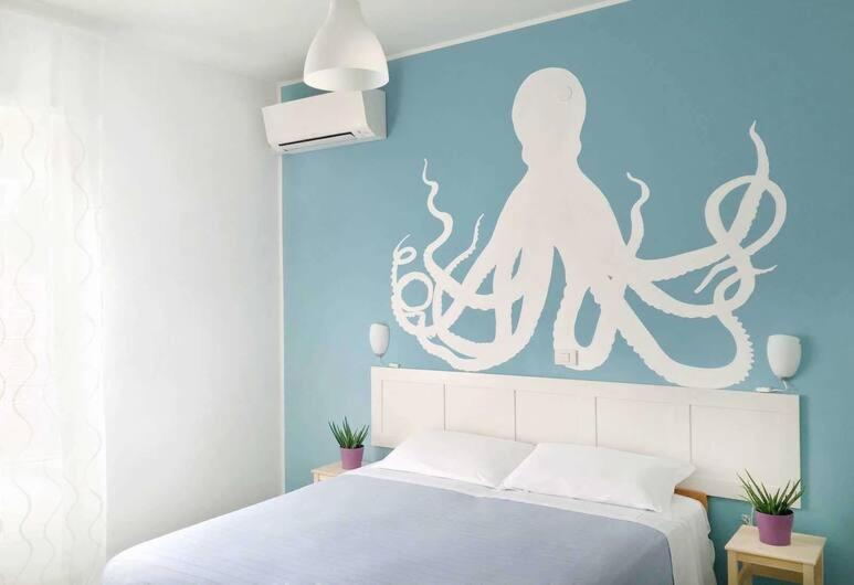 Postel nebo postele na pokoji v ubytování Hotel Aloha