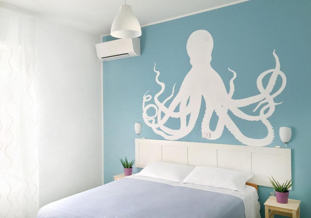 Postel nebo postele na pokoji v ubytování Hotel Aloha