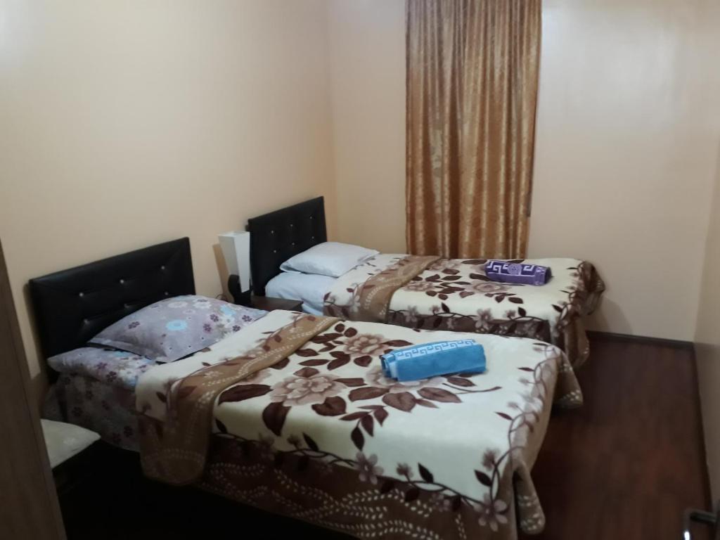 Postel nebo postele na pokoji v ubytování Guest House Karati