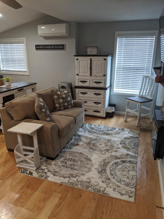 a living room with a couch and a table at Heidi Motel - Helen in Helen