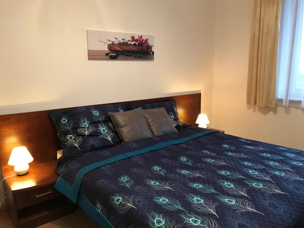 Postel nebo postele na pokoji v ubytování Apartmán Bella Donovaly v hotelovom komplexe