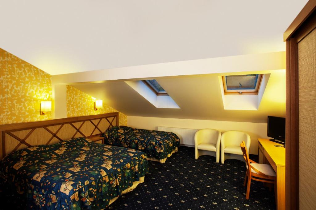 Postel nebo postele na pokoji v ubytování Park Villa Hotel